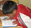 Peruvian boy reading